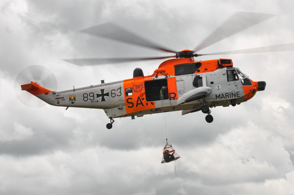 The German "Retro" SeaKing during a rescue/winch demonstration in Belgium. The rescue of an injured crew member was shown. The SeaKing shows the special paint for the 50th anniversary.