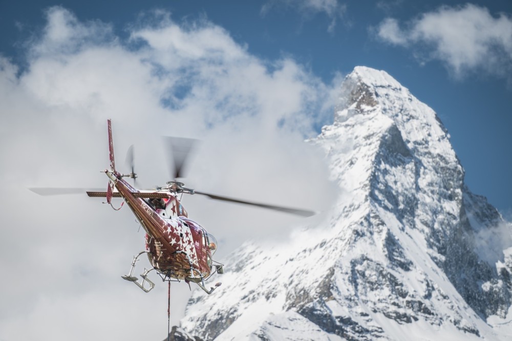 Air Zermatt HB-ZOY - Helicopter External Sling Load (HESLO) in the municipality of Zermatt. 
Helicopter sling load operations in a village require careful planning, skilled crews, and a focus on safety and precision to successfully carry out tasks in an urban setting.