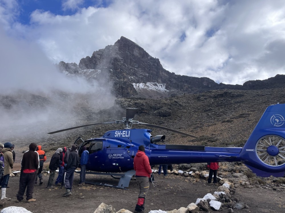 Kilimanjaro mountain rescue @15000feet.
The client was suffering form pulmonary edema and required evaluation off the mountain. Weather conditions where constantly changing we had to shut down and wait for cloud break which came soon the mist can be seen moving off to the left of the photo.