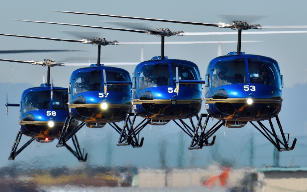 Four JGSDF TH-480 (Enstrom 480) of "Akeno Rainbow" demonstration team are taxing in trail formation.