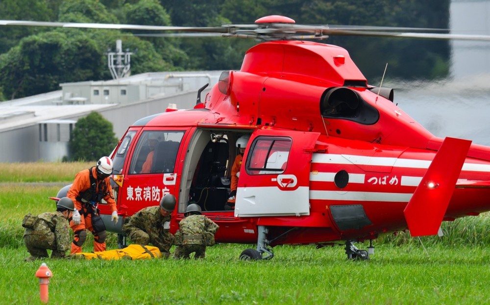 Tokyo Fire Dept. AS365N3, "Tsubame" (swallow), is conducting rescue demonstration.