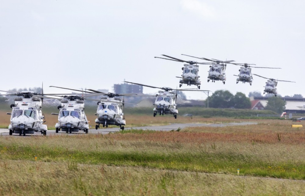 8 dutch nh 90 helicopters landing after flying a tour over Holland. Please note the third helicopter having a blue dot meaning it fly over the arctic (witch is quite far from Holland)