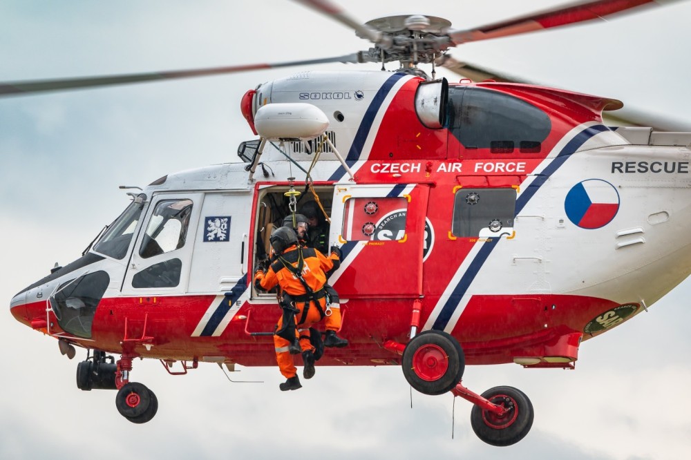 The PZL W-3 Sokół search and rescue helicopter from the 243rd Helicopter Squadron of the Czech Air Force is performing a winch demonstration at an airshow in Belgium.