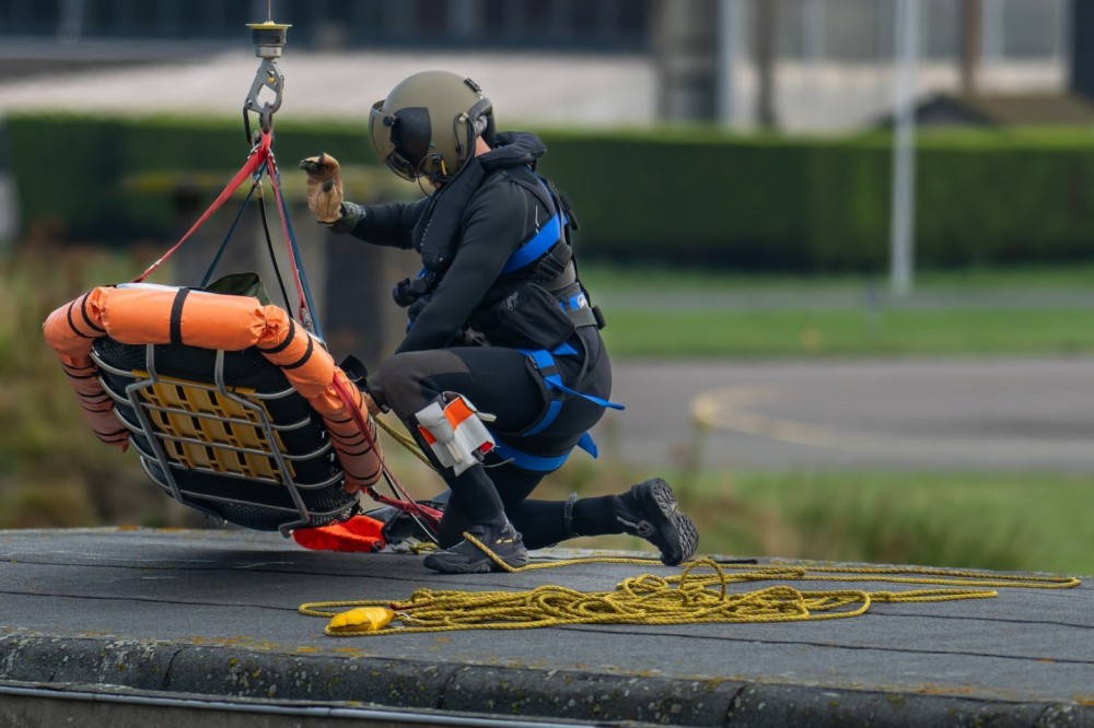 Belgian Air Force 40th Squadron Search & Rescue NH90
@ home base Koksijde Belgium

diver preparing the stretcher for hoisting