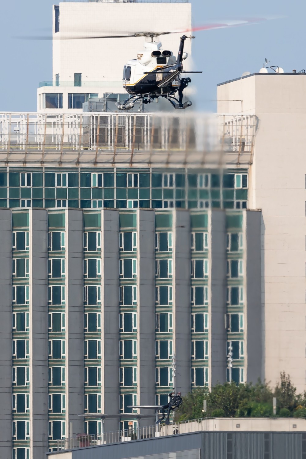 An NYPD Subaru-Bell 412EPX hoisting a diver into the Hudson River just north of the West 30th Street Heliport