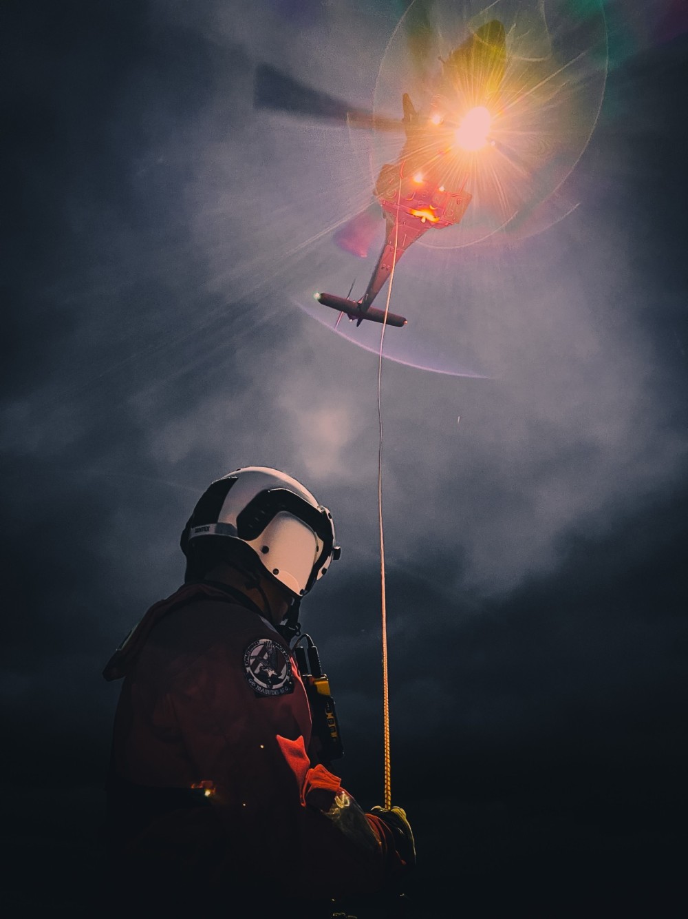 Rescue swimmer holding the "guide line" to prevent spinning during hoisting. Normally I´m in the cockpit, but I take every chance I can to participate when I´m not flying. Then I can bring my camera and shoot some cool action pictures.