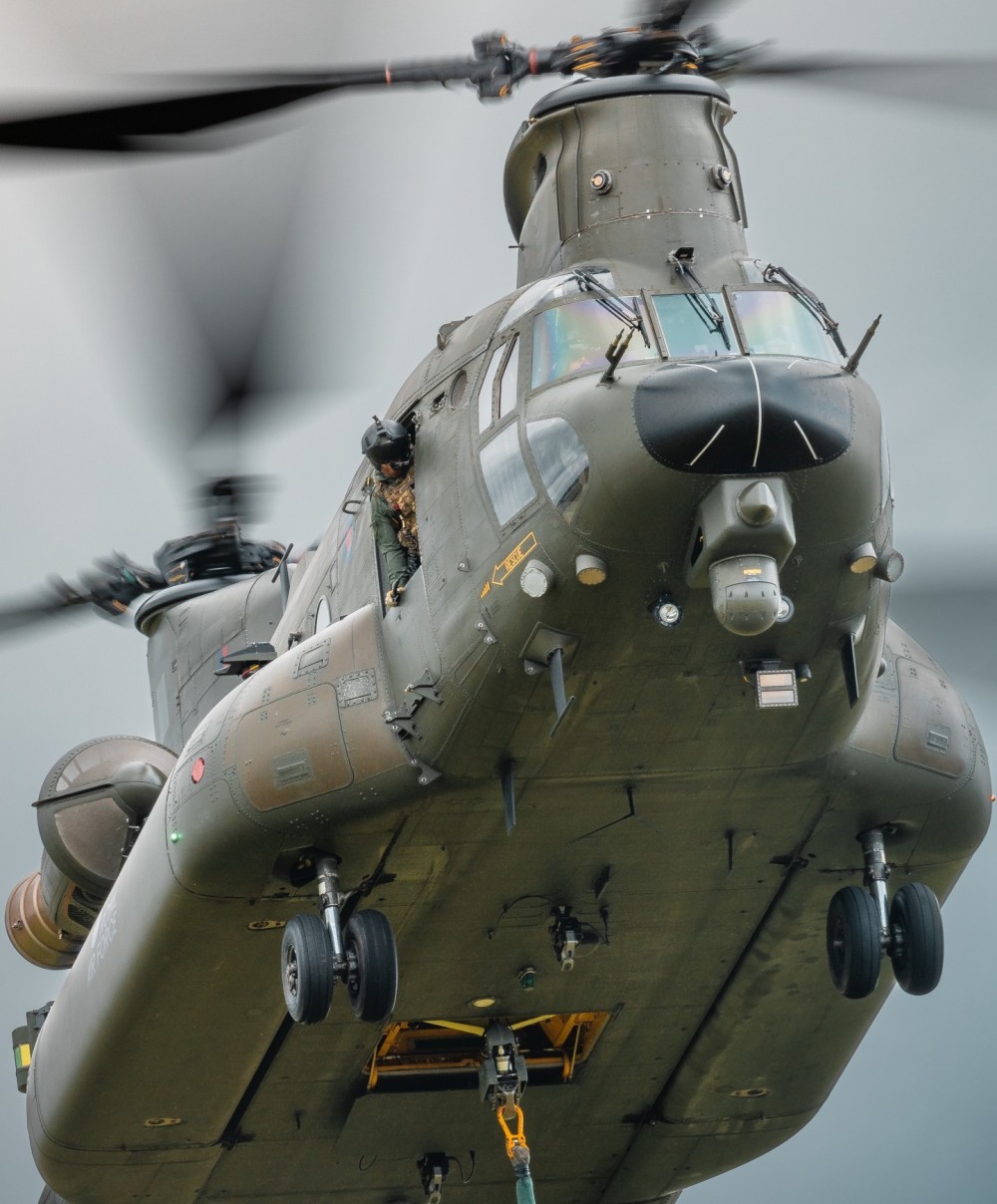 Image of an RAF Chinook, flying out of RAF Odiham, during her display and role demonstration at the 2024 Cosford Airshow displaying at the only RAF endorsed airshow left.