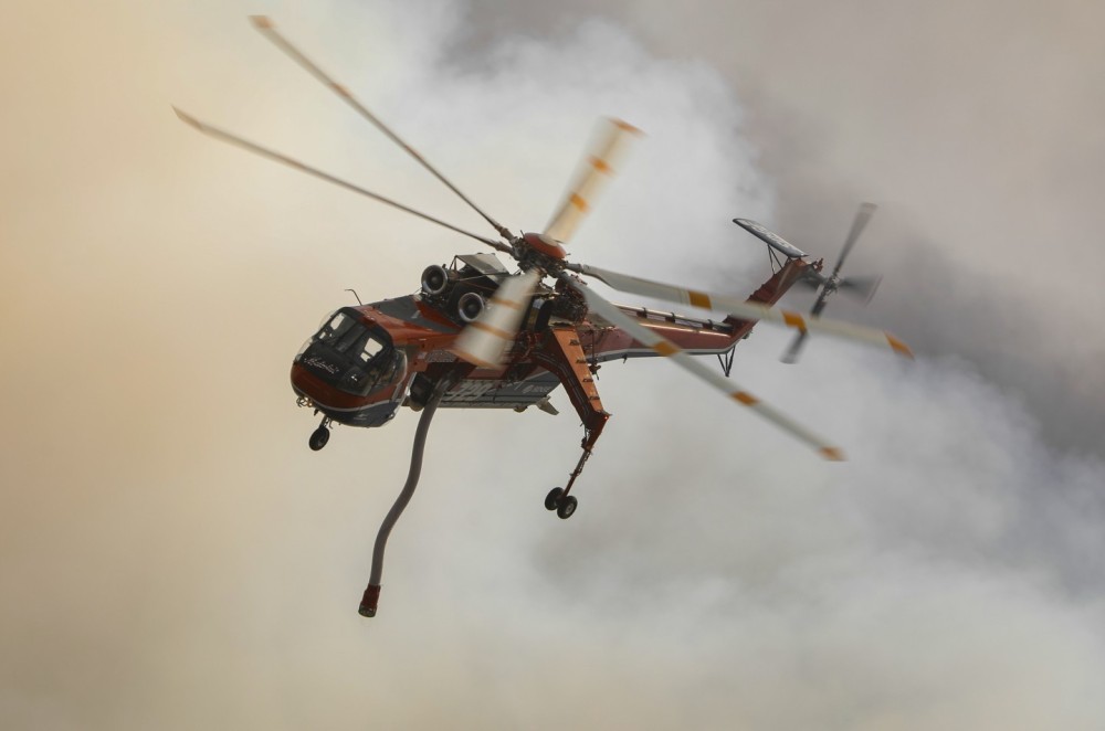 Helitanker 729 swinging around after making a successful water drop (amid high winds in the area) on a large vegetation fire off Old Hwy 80, just North of Campo, CA.