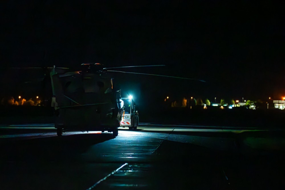 Belgian Air Force
Technicians  driving the NH90 heli back in to the hangar after a night operation above the North Sea