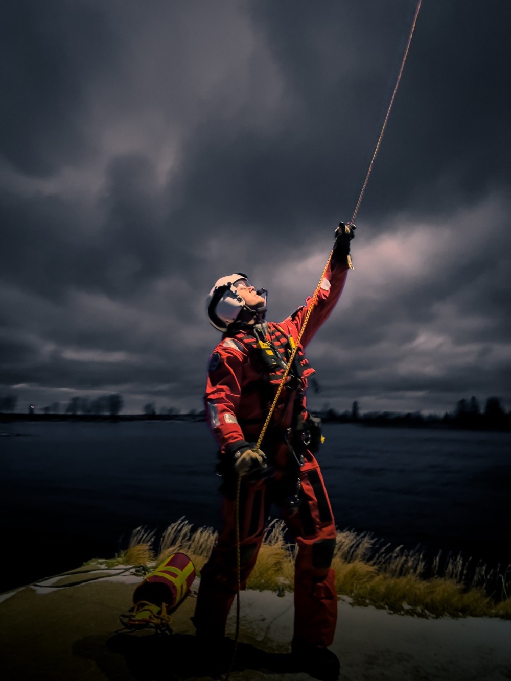 Rescue swimmer guiding the strecher towards the ground during rutine practice in the Baltic Sea. We work for the Swedish Maritime Administration as the airborne Search and rescue units.