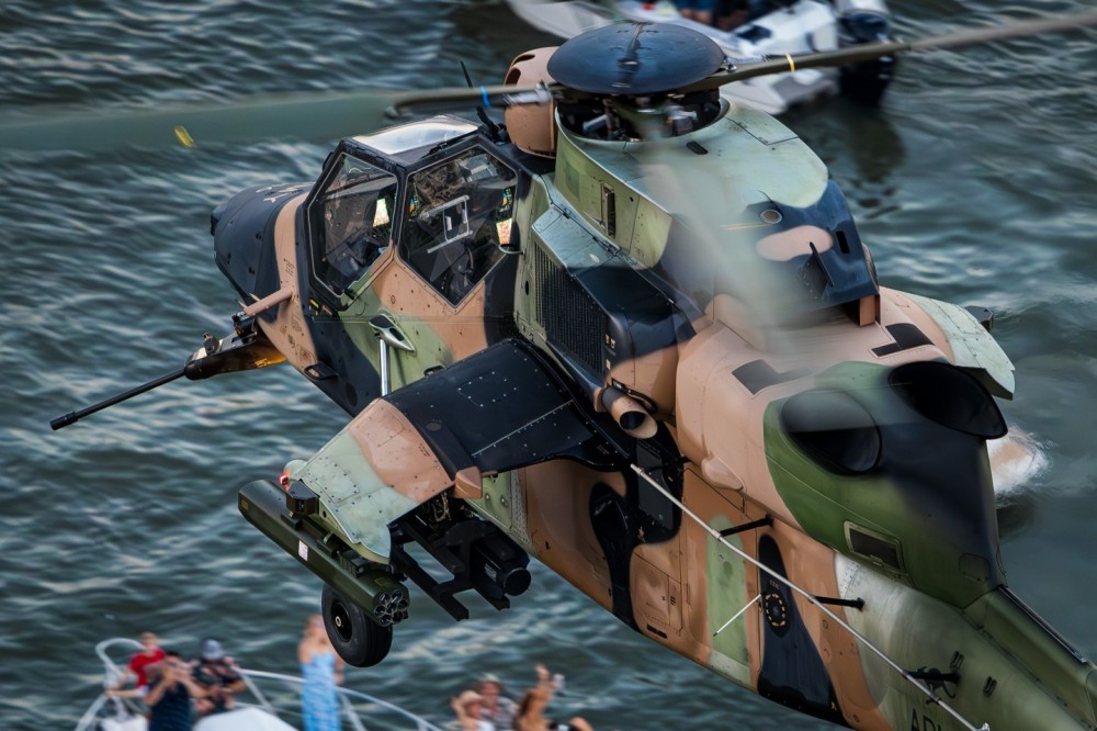 Australian Army Aviation Corps ARH Tiger 'A38-016' passes over spectators on boats on the Brisbane River during the annual Riverfire display. A handful of ARH Tigers are based at the nearby Swartz Barracks as part of the Army Aviation Training Centre.