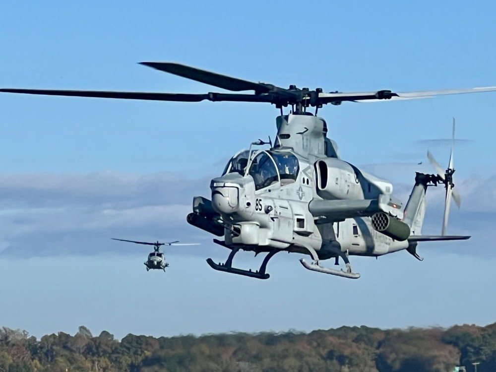 I was lucky enough to be at our hangar when these guys came in.  Here is a United States Marine Corps Cobra air taxing at Hampton Roads Executive airport with their wingman in the background.