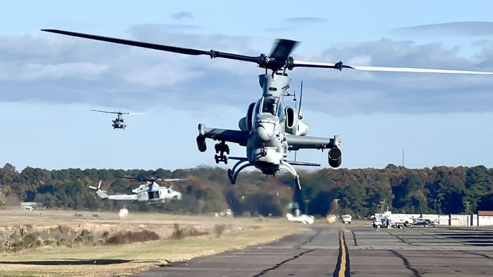 I was lucky enough to be at our hangar when these guys came in.  Here is a United States Marine Corps Cobra air taxing at Hampton Roads Executive airport with their wingman in the background.