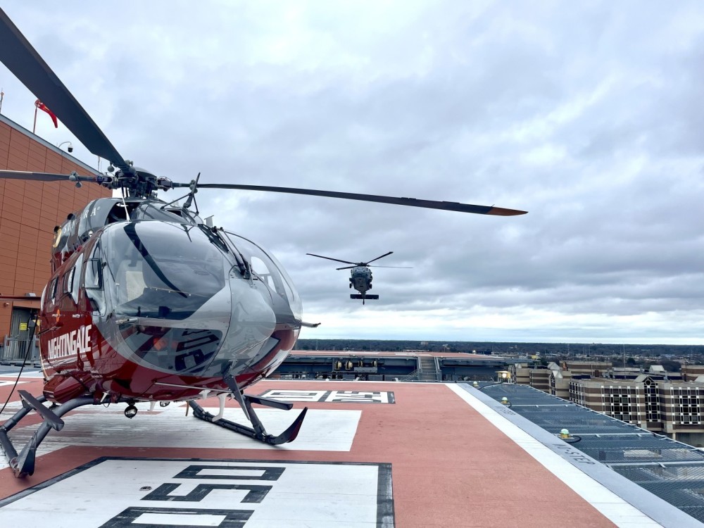 A Navy H-60S come in for landing at Sentara Norfolk General Hospital.  Nightingale sits in the foreground.