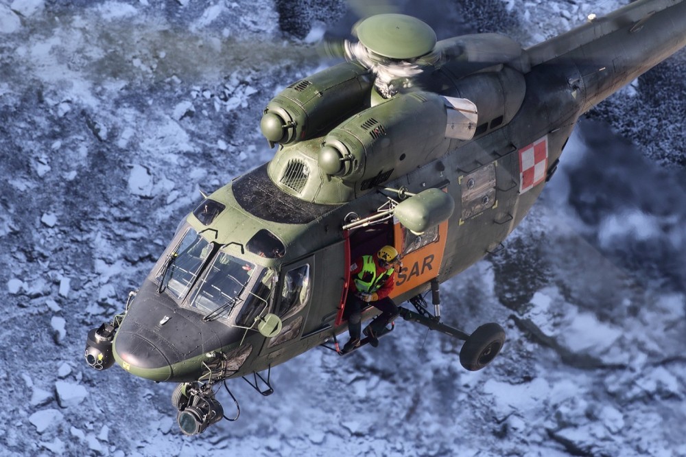 Polish Air Force SAR W-3 with Tatra Mountain Rescuer onboard during training sortie in Tatra mountains.