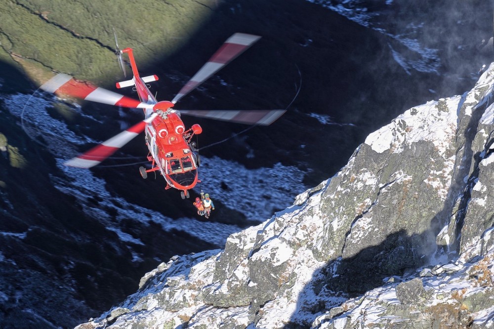 Tatra Mountain Rescuers during hoist operation near Koscielec summit.