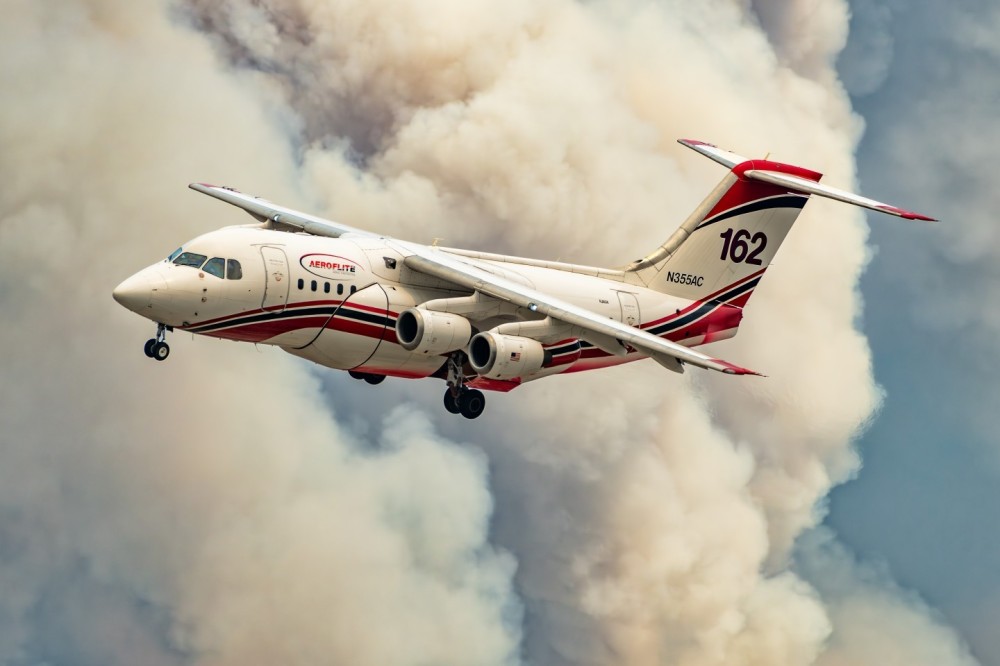 Various Air Tankers were coming back to San Bernardino International Airport after dropping on the Line Fire in the San Bernardino Mountains. I knew if I positioned myself in the right location when they were landing, I could get the aircraft with the smoke-filled sky behind them. Even the sky around the airport, was filled with a light layer of smoke that produced very warm light. The light reflecting on Aero-Flite's BAe RJ85 was very diffused and warm.