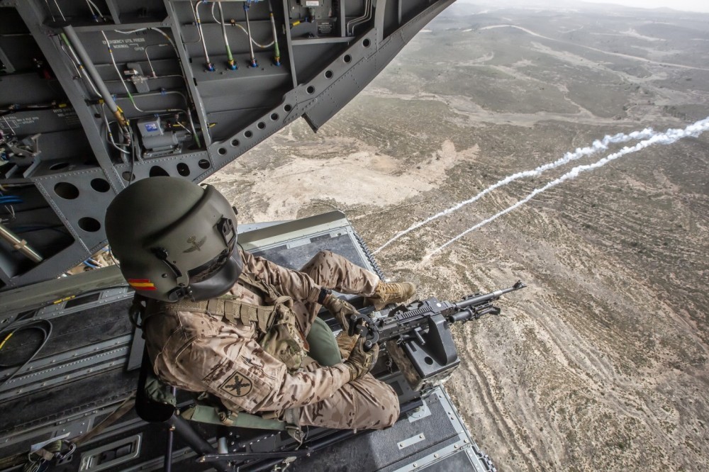 Ramp shooter  a CH-47 Foxtrot of the Transport Helicopter Battalion V (BHELTRA V) of the Spanish Army Aviation with its machine gun during a countermeasures shooting exercise.