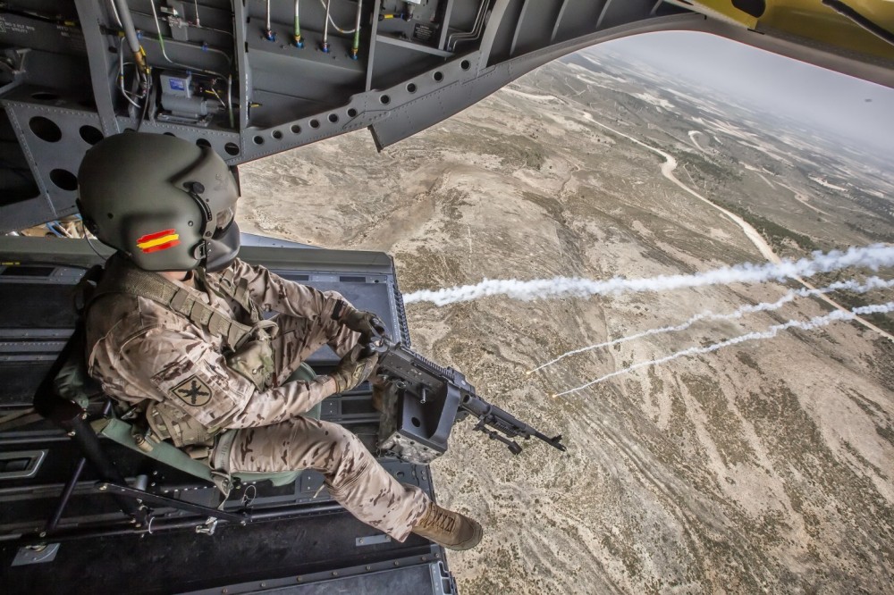 Ramp shooter  a CH-47 Foxtrot of the Transport Helicopter Battalion V (BHELTRA V) of the Spanish Army Aviation with its machine gun during a countermeasures shooting exercise.