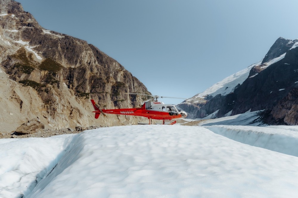 Perched on the ice during a sightseeing tour on the Chilkat Glacier located northwest of Skagway, AK. Perfect weather days creates opportunity to explore glaciers that are normally not accessible due to low ceilings or poor visibility.