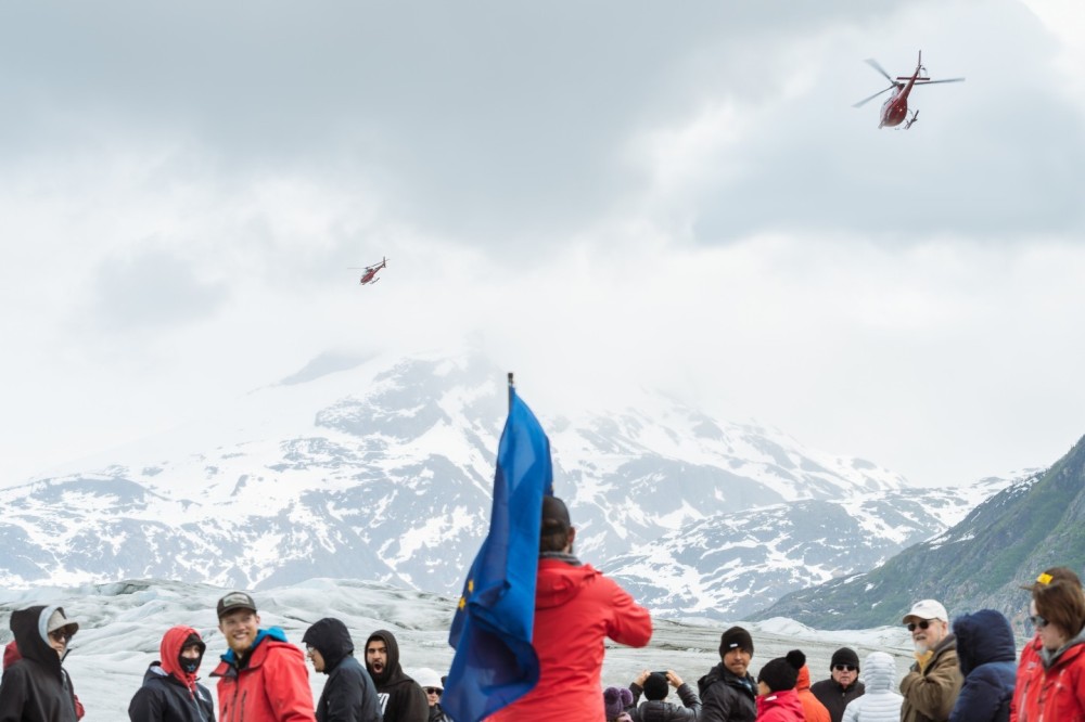 Excited guests arriving to the Meade Glacier, just outside of Skagway, AK. Lead by a group of professional ice guides, they explore the glacier while the 2 helicopters head back to base to pick up the next group.