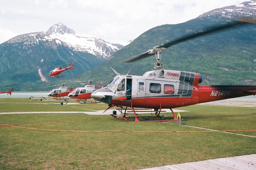 A group of ASTARs head out to bring guests to a nearby glacier while the 214-B1 sets up his long. Shot on 35mm ECTAR 100 film and developed by Dale Labs.