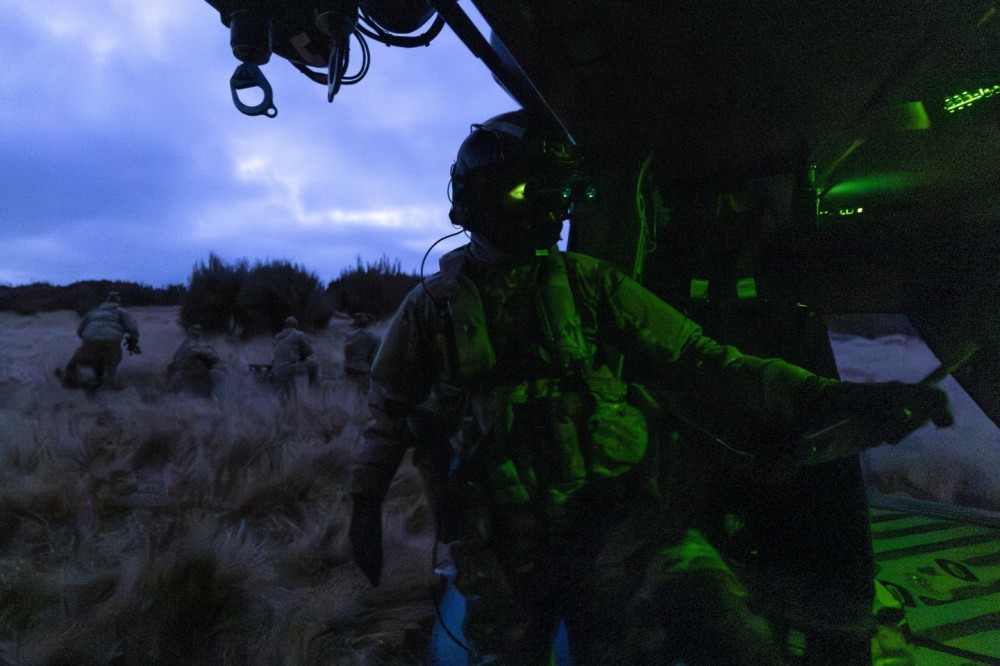 One of the loadmasters of a Royal New Zealand Air Force NH90 pauses as we delivered a section of infantry to their final location of the day. We were racing to beat a storm in the late evening, and everything was pitch black. There was just enough light coming from the loadmaster's night vision goggles to focus this shot.