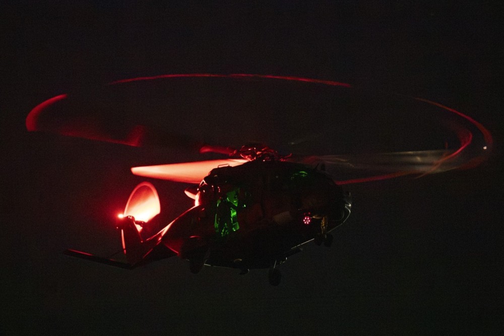 During a tactical night exercise, a Royal New Zealand Air Force NH90 kicked up enough dust from a nearby riverbed to take the scene into science-fiction territory