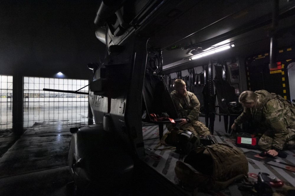 I couldn't resist this shot of Royal New Zealand Air Force NH90 loadmasters slowly packing up after a midnight return from a job