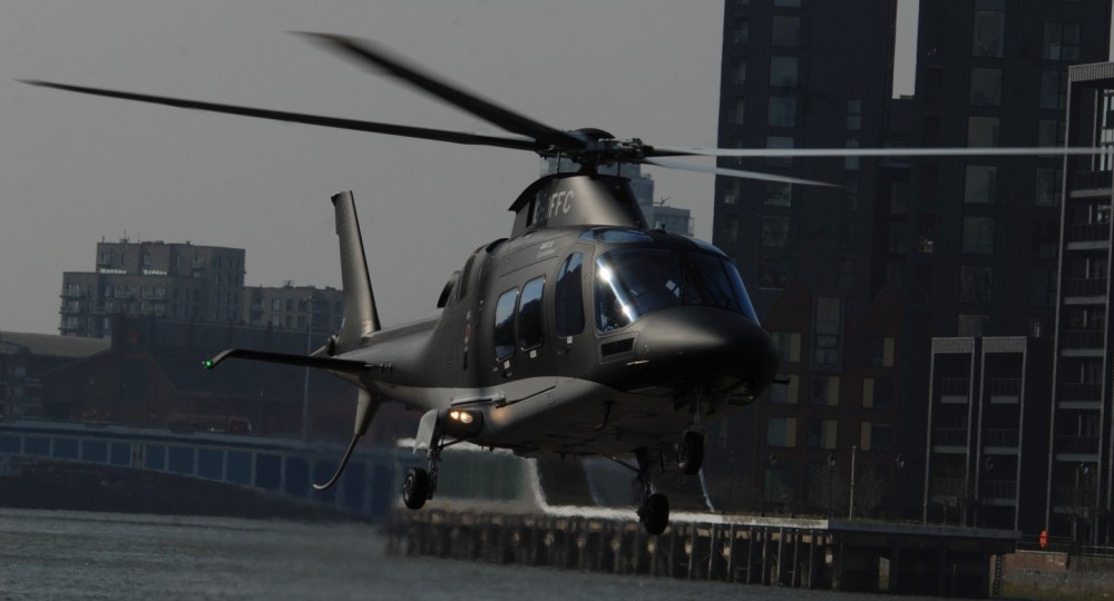 Leonardo AW109SP operated by Saxon Air lifting from the Thames riverside Edmiston London Heliport at Battersea's South of Chelsea Harbour in Southeast London, UK.