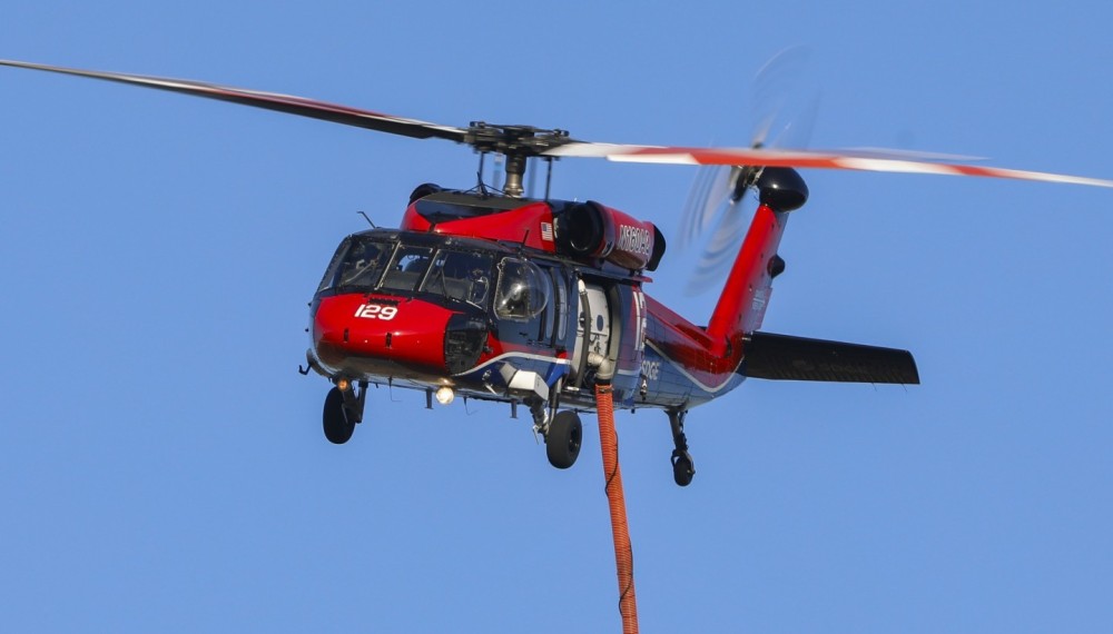 Copter 129 (a Sikorsky UH-60 Black Hawk) operated by San Diego Gas & Electric or SDG&E, arriving on scene of a vegetation fire in Jamul, CA that sparked for unknown reasons.