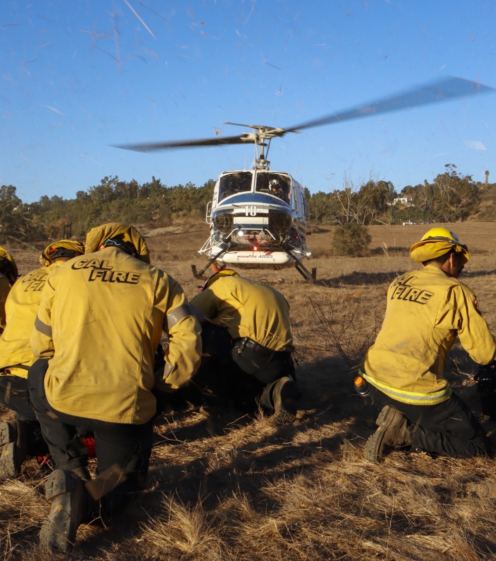 Copter 10 from the San Diego County Sheriff Department's ASTREA Unit, arriving at the landing zone to grab the first of two CAL FIRE San Diego Gillespie Helitack crews, at the end of the 50 acre Garden Fire in Fallbrook, CA.