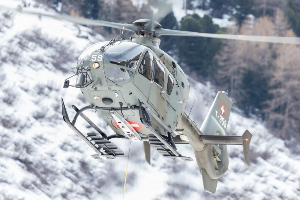 Swiss Air Force helicopter at work in Arolla in Valais (Switzerland). Transport for the organisation of the ‘Patrouille des Glaciers’ ski mountaineering race between Zermatt and Verbier. Eurocopter EC635P2, T-364