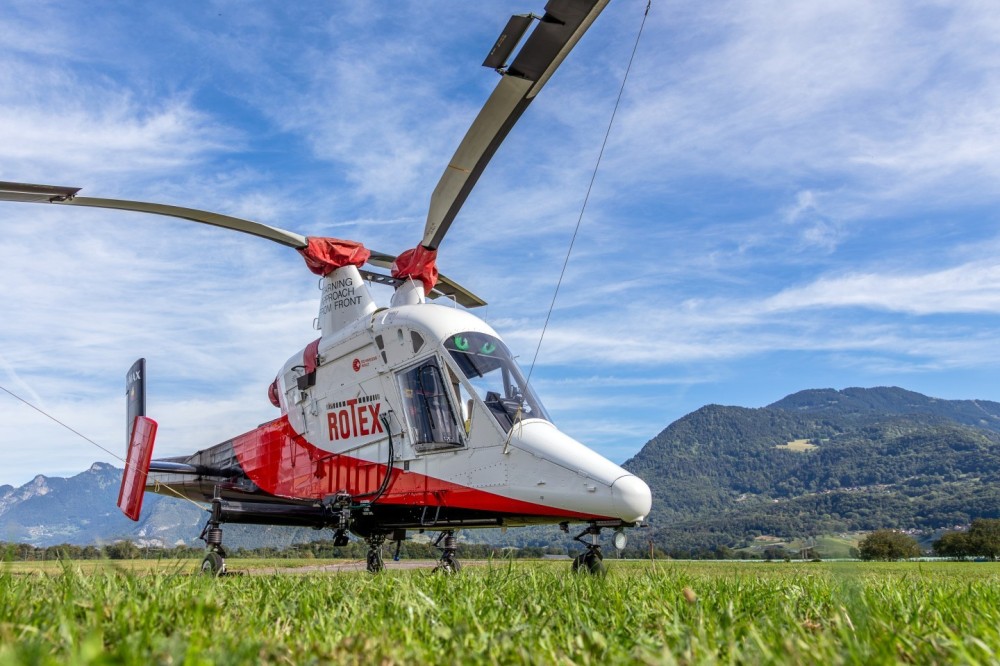 A "K-Max" Helicopter of Rotex, displayed at an open day at Bex airfield in Switzerland. The Kaman K-Max K-1200 was exclusively designed for transporting loads. The single-seater was developed and manufactured in America by Kaman Aerospace. HB-ZPO, 07.09.2024, Bex, Switzerland.