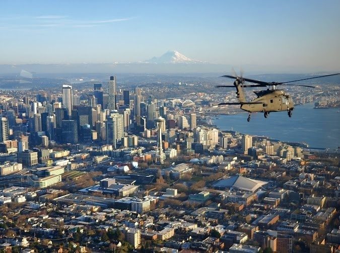 My company, C Co CrazyHawks 2-158AHB, was selected to fly the Chairman of the Joint Chief of Staff General Mark Milley and his staff around western Washington. We departed Joint Base Lewis-McChord and took him to a naval submarine station north of Seattle for a conference. After the conference we gave him a scenic tour of Seattle. That is when I took the picture of the aircraft he was in as we approached the Space Needle.