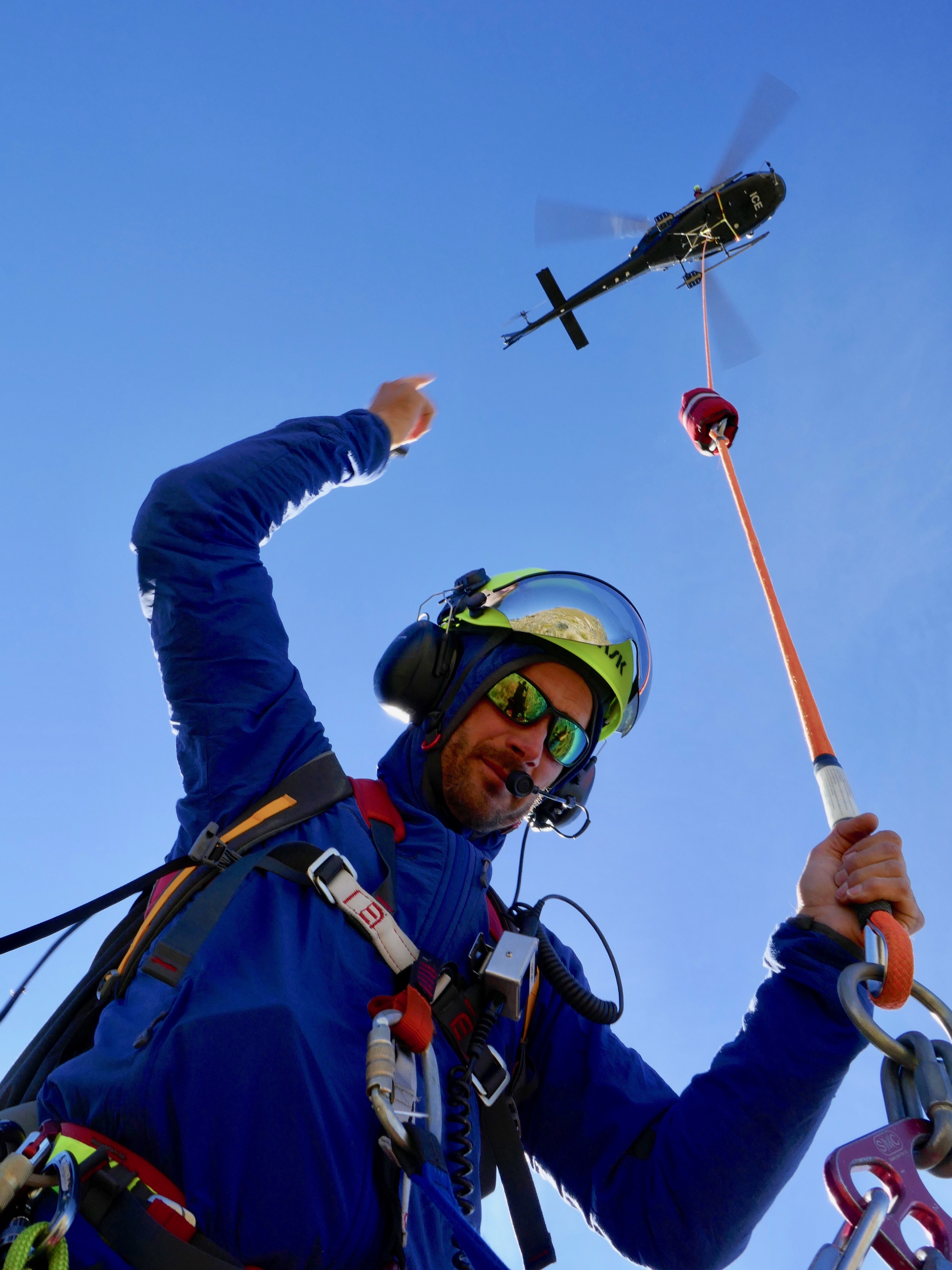 Georges Millet on the Long line with the Queenstown Alpine Cliff Rescue Team at the Remarkables Range, Queenstown.  Heliworks NF squirrel Helicopter flown by Nick Nicholson