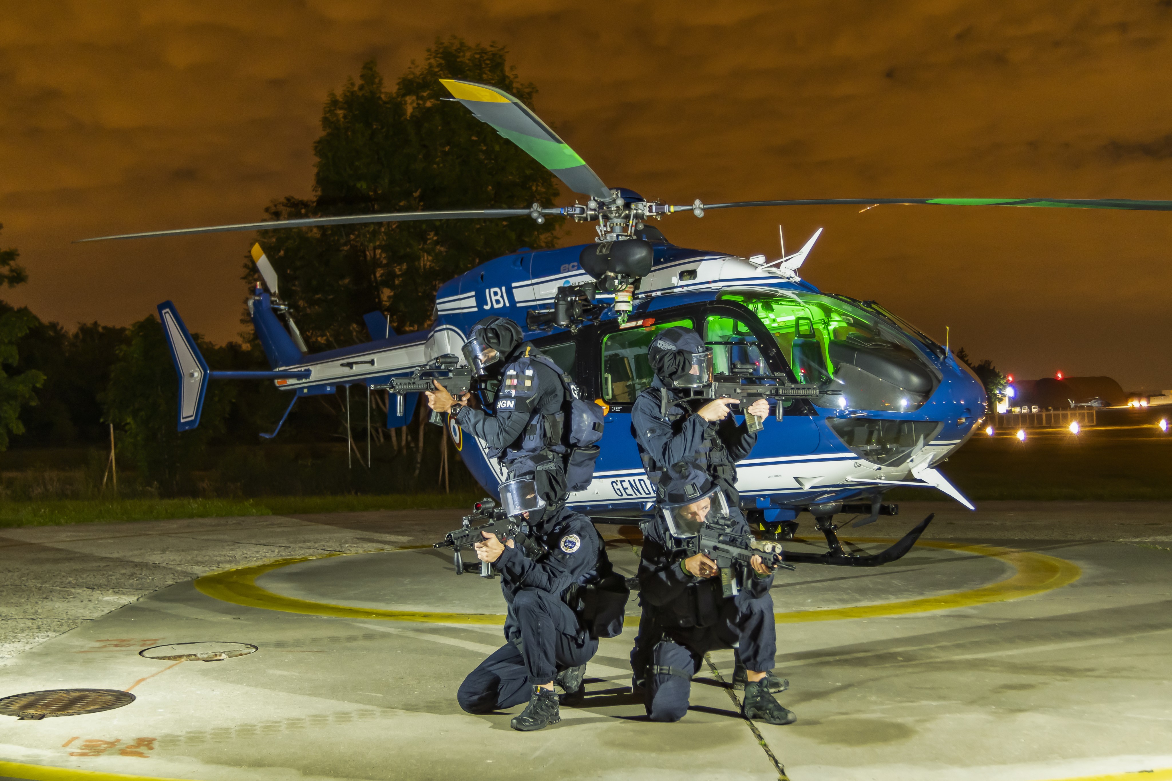 The Special Forces of the French police (GIGN) posing in front of the Airbus EC135 of the Gendarmerie Air Forces (CFAGN) after the night training near Paris.