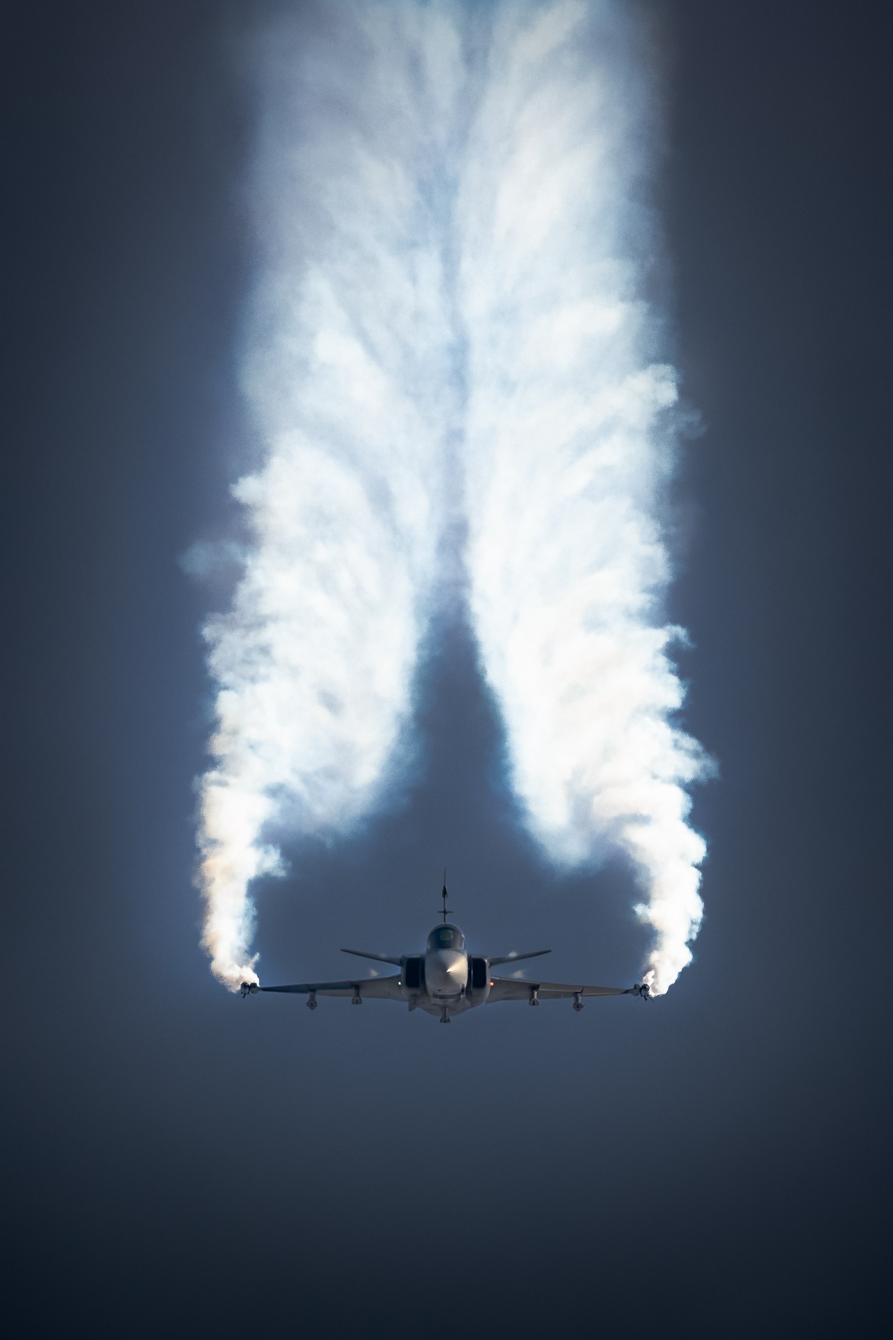 Falling Angel - Hungarian Air Force SAAB JAS-39C Gripen, put to work by demo pilot Máté Majerik, falls from the sky on smoky wings in a stunning display at The Royal International Air Tattoo