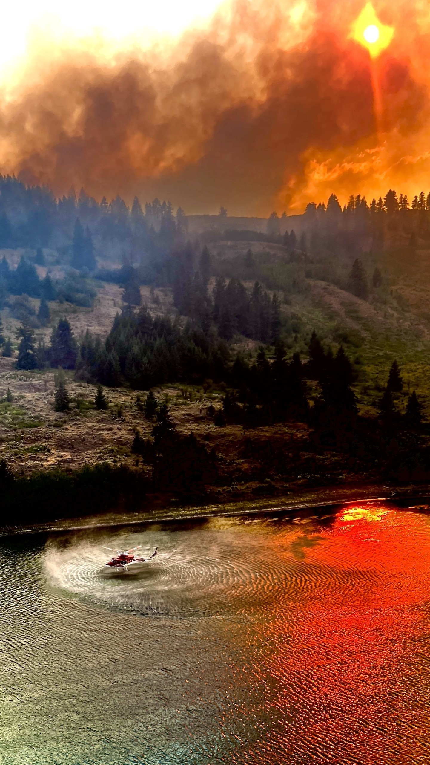 Photo was taken just outside of Osoyoos, BC this summer when they evacuated part of the town. Was just in a rotation for the dip site when the photo was taken.