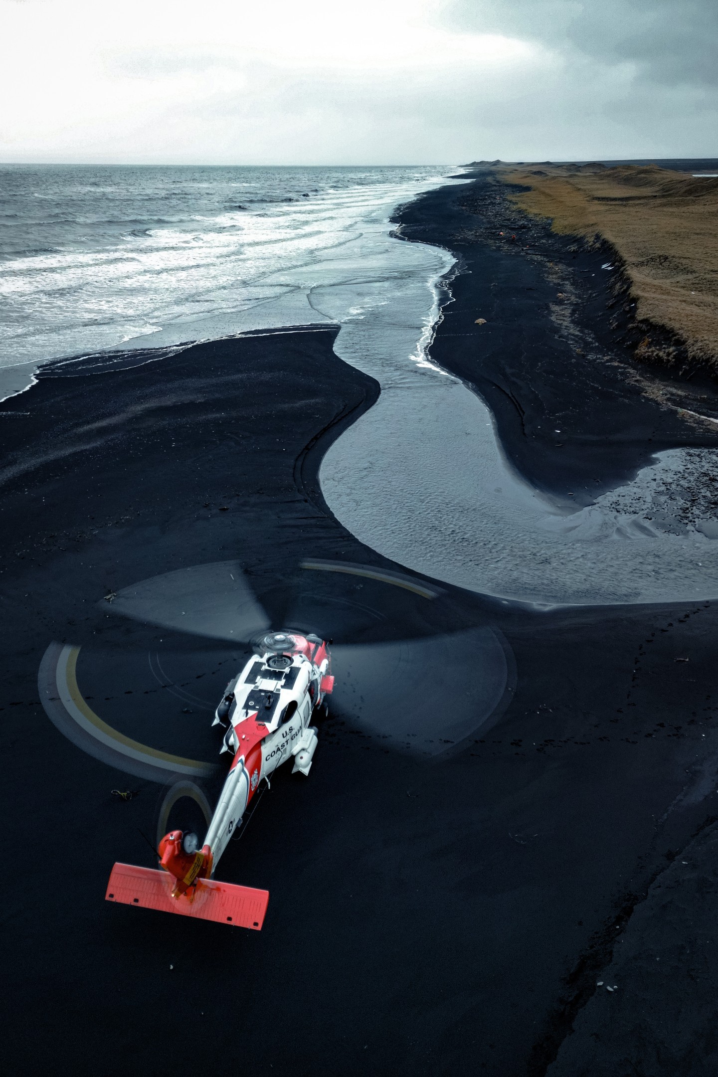 A United Stated Coast Guard Air Station Kodiak MH-60T Jayhawk helicopter conducts off airport landing training near Cold Bay, Alaska in the Aleutian Islands.