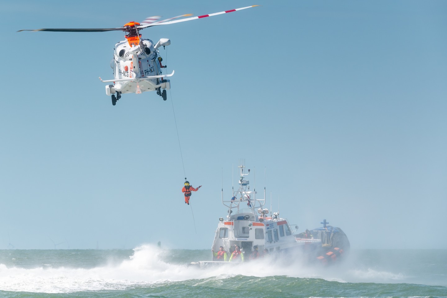 Winching exercise at the North Sea with a Leonardo AW189 SAR helicopter of the Netherlands Coastguard. The Netherlands Coastguard is a civil organisation that carries out tasks on the Netherlands North Sea for six Ministries under administration of the Royal Netherlands Navy.