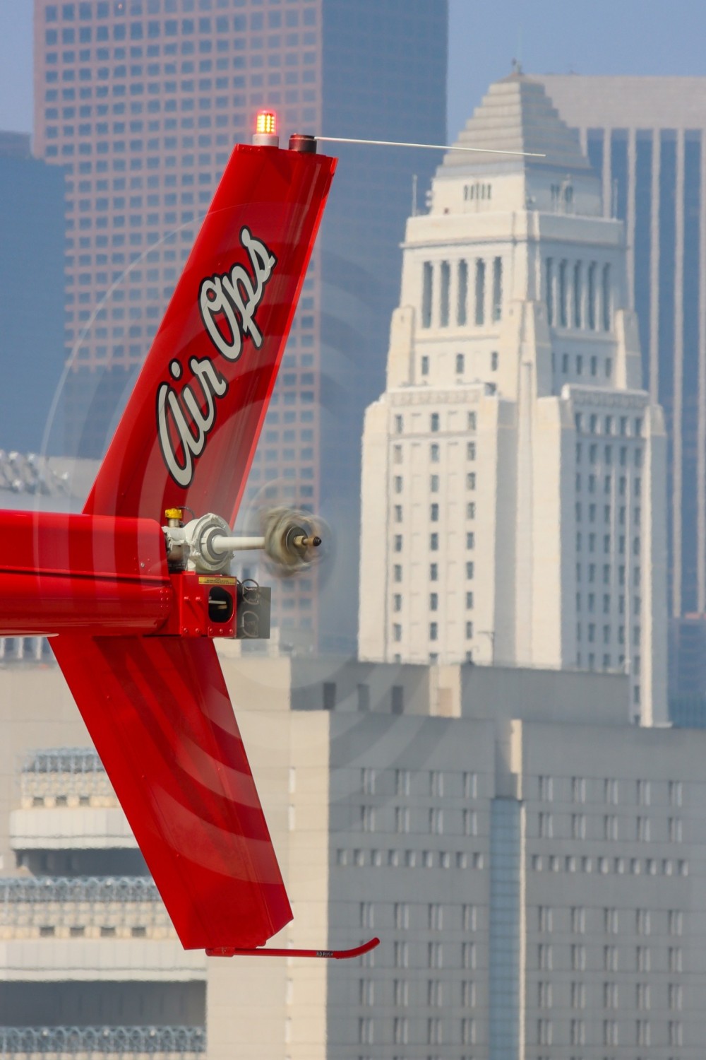 The Los Angeles Police and Fire Departments work closely together.  New LAFD pilots receive initial training from LAPD instructor pilots prior to moving into the Fire Department's AW-139's.  Here a Fire pilot in training spools up Fire-6, a Bell 505, with the iconic City Hall in the background.