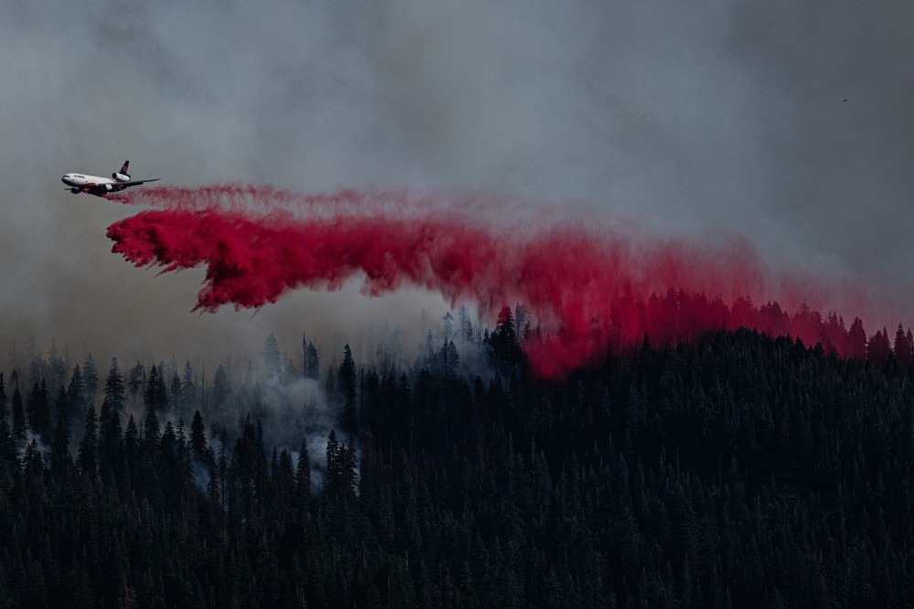 10 Tanker DC10 at work on the northern flank of the Park Fire , California. On contract with CalFire the VLAT was slowing down the northern flank as it edges towards the mountain village of Mineral. The Park Fire was the largest arson lit fire in Californian history