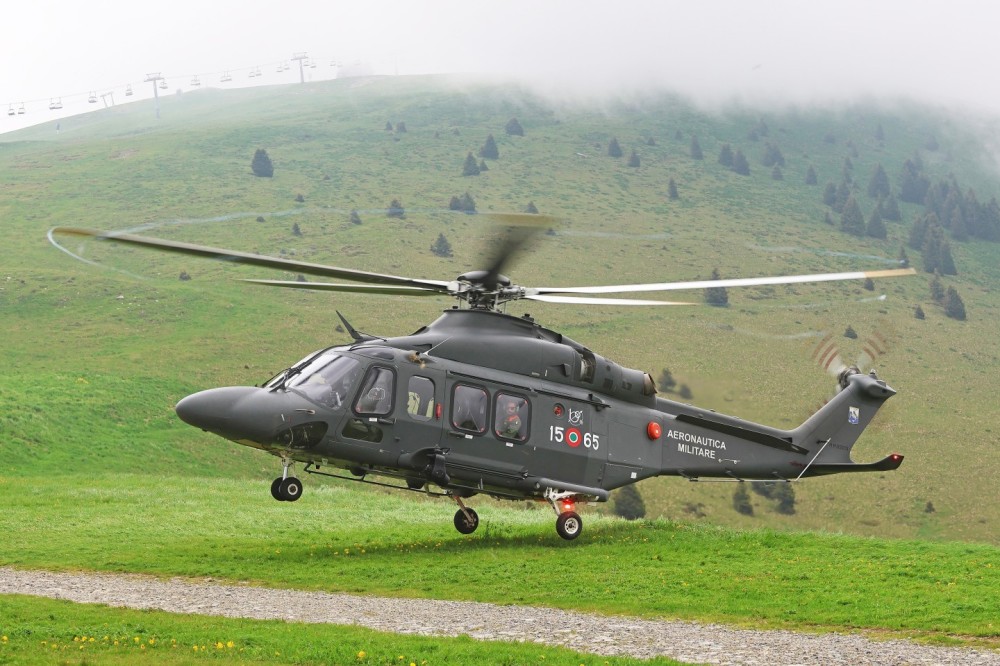 HH-139B (15-65 MM82013) Search and Rescue helicopter of Aeronautica Militare / Italian Air Force taking off during a mountain training exercise in the Italian Alps.