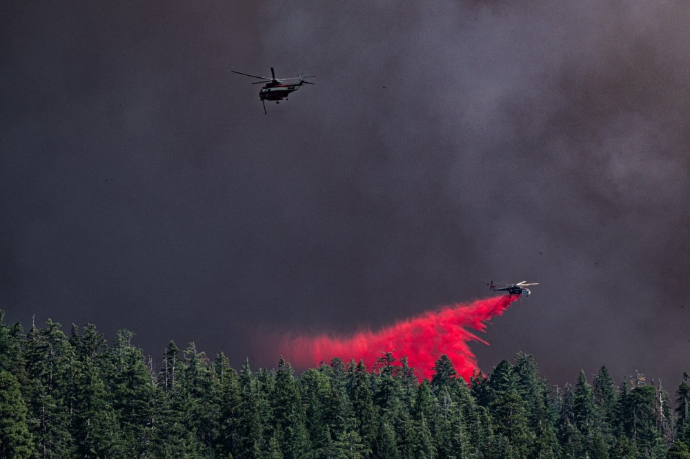 A Sillar Brothers owned SH-3 Sea King on contract with CalFire and a CalFire Aircrane at work on the Park Fire as it pushed towards Mineral in California