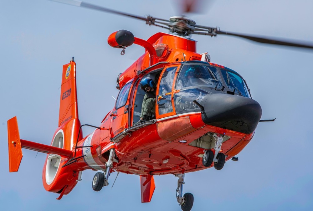 An Airbus MH-65E Dolphin assigned to Coast Guard Air Station San Francisco, CA, arrives in Anaheim, CA for an exclusive helicopter event on Feb. 23, 2024.