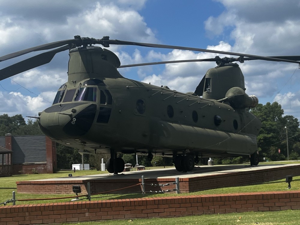 CH-47 at Fort Novosel AL located next to Headquarters building on Novosel Avenue across from the parade field and near the old Officers Club. It is part of a display of four military helicopters; AH-1 Cobra, OH-58 Kiowa, UH-60 , and CH-47