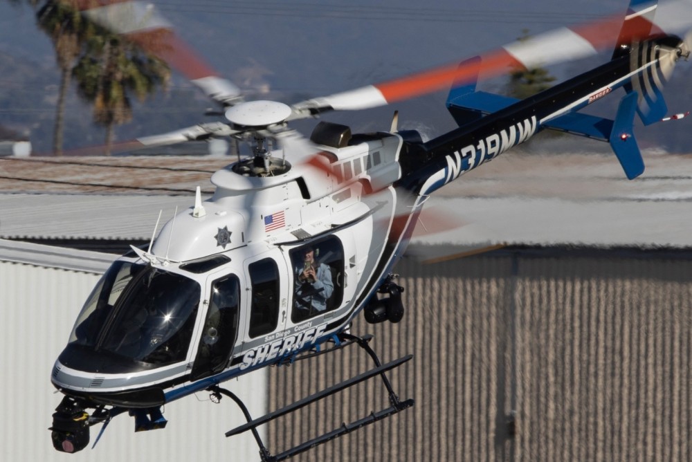 During the evening hours on a Monday, a Bell 407GXI operated by the San Diego County Sheriff's Aerial Support to Regional Enforcement Agencies (ASTREA) unit, sets out on patrol with a ride along passenger for the duration of the flight.