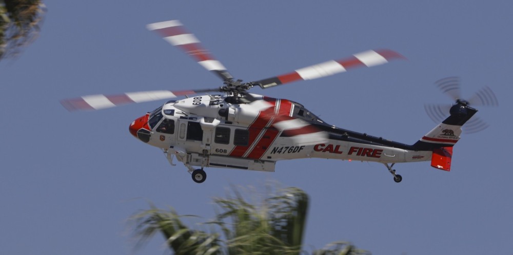 CAL FIRE Copter 608 from the CAL FIRE Riverside Unit, responds to a raging 890 acre vegetation fire dubbed the "Lisa Fire" off Highway 60 in Riverside County, CA.