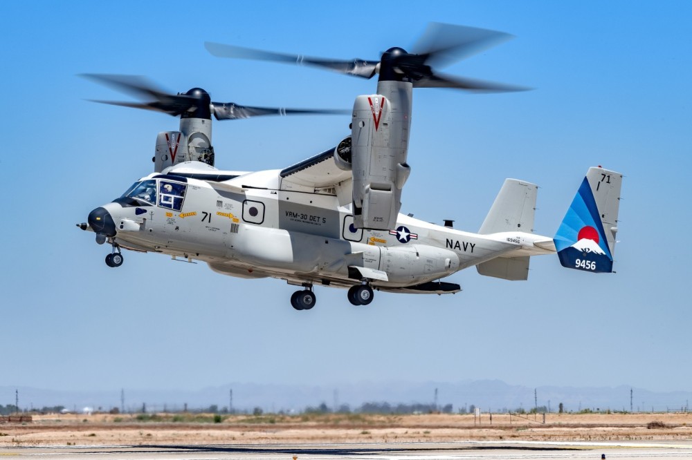 A VRM-30 DET 5 Osprey does touch and goes at NAF El Centro, California. I got permission to go out next to the runway and the lighting when the Osprey arrived,  was "picture perfect". I used a very slow shutter speed of 1/100 of a second in order to blurred the slow moving props and still keep the aircraft sharp.